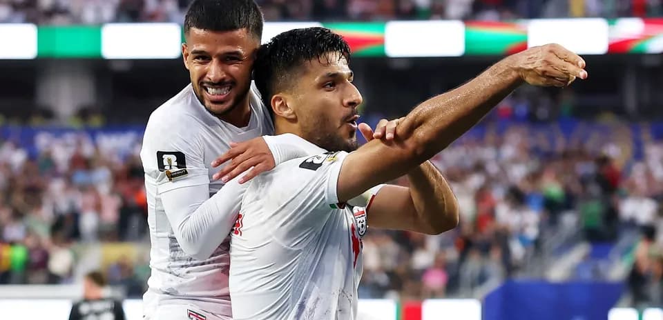 Two players celebrating a goal during match
