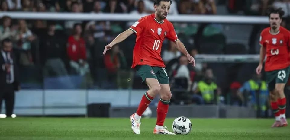 Player dribbling ball during football match