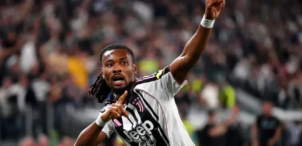Player celebrating goal with raised finger at stadium