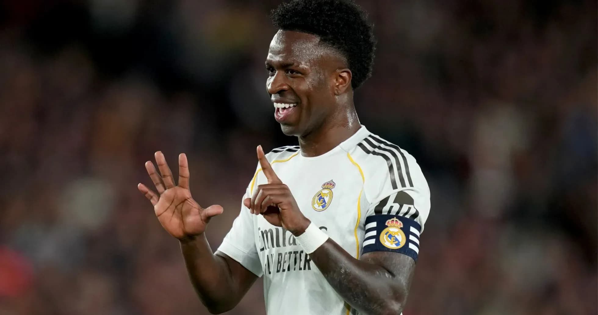 Player celebrating during a match wearing Real Madrid kit