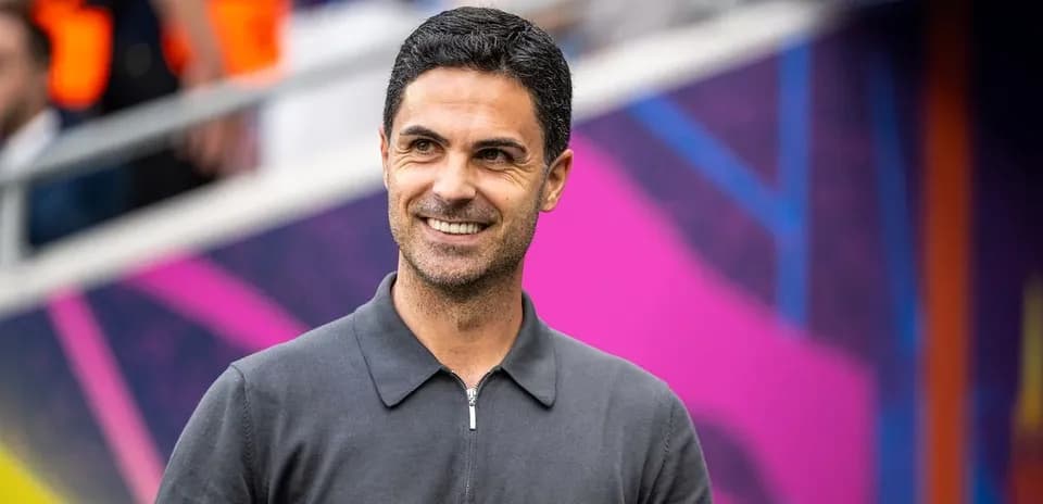 Coach smiling during match day preparations