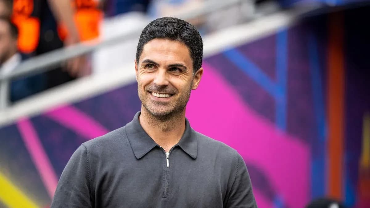 Coach smiling during match day preparations