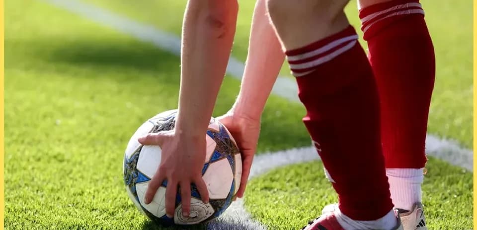 Player preparing to take a throw-in with ball