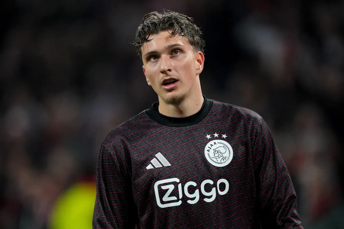Goalkeeper in Ajax kit during match action