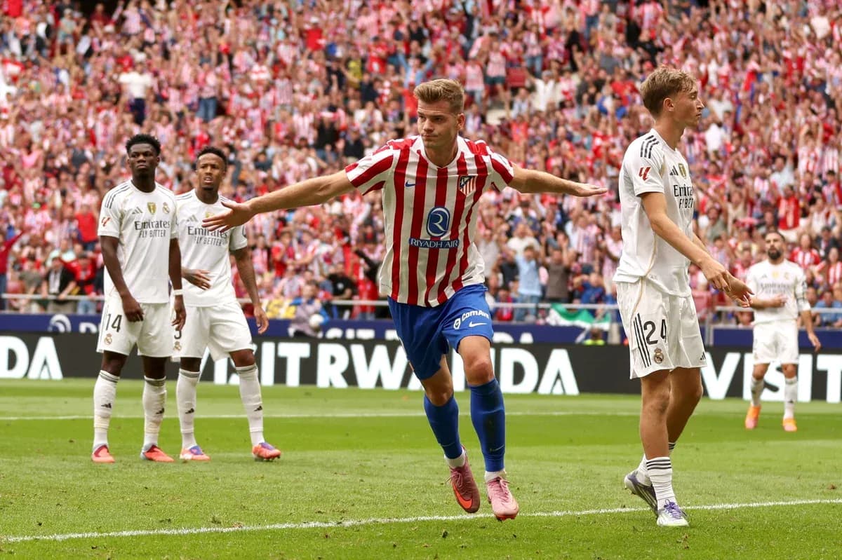 Atletico Madrid player celebrating a goal against Real Madrid
