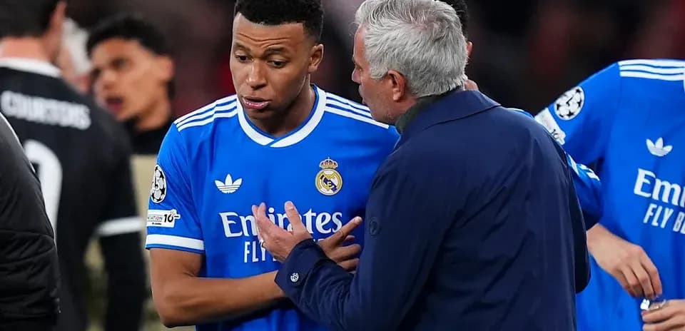 Player discussing strategy with coach during match
