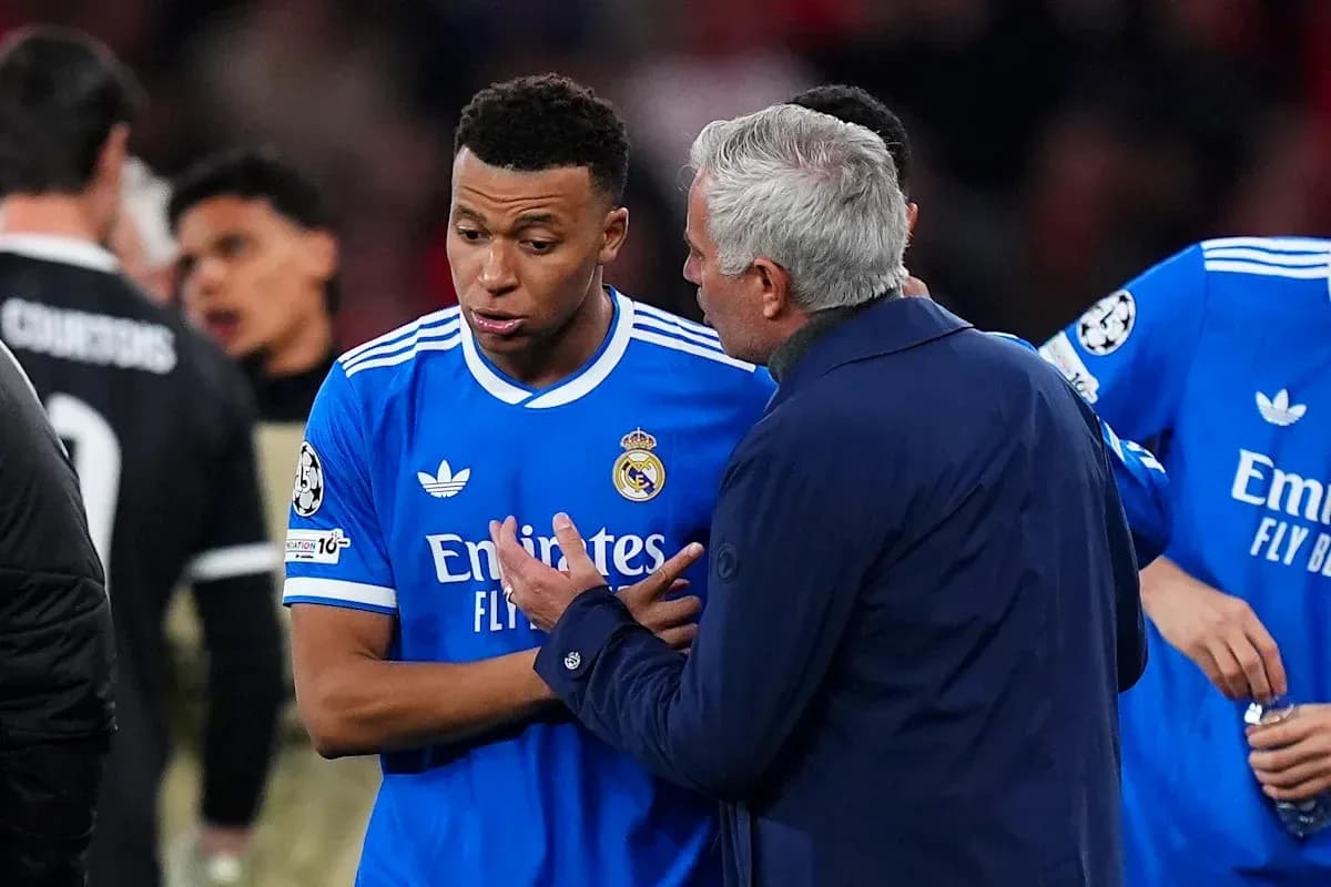 Player discussing strategy with coach during match