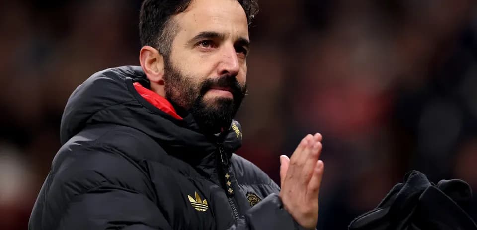 Coach applauding fans after the match