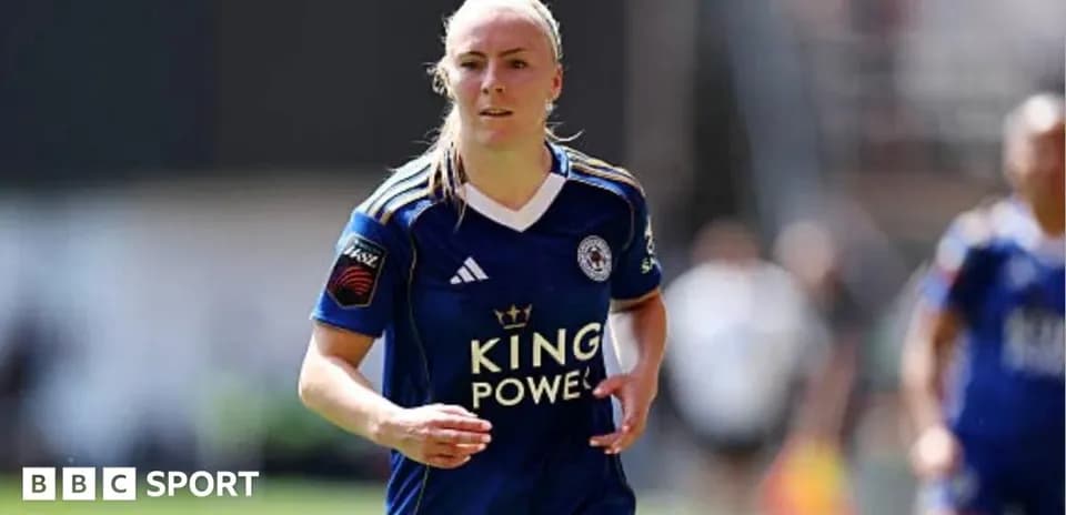 Female player in blue jersey running on field