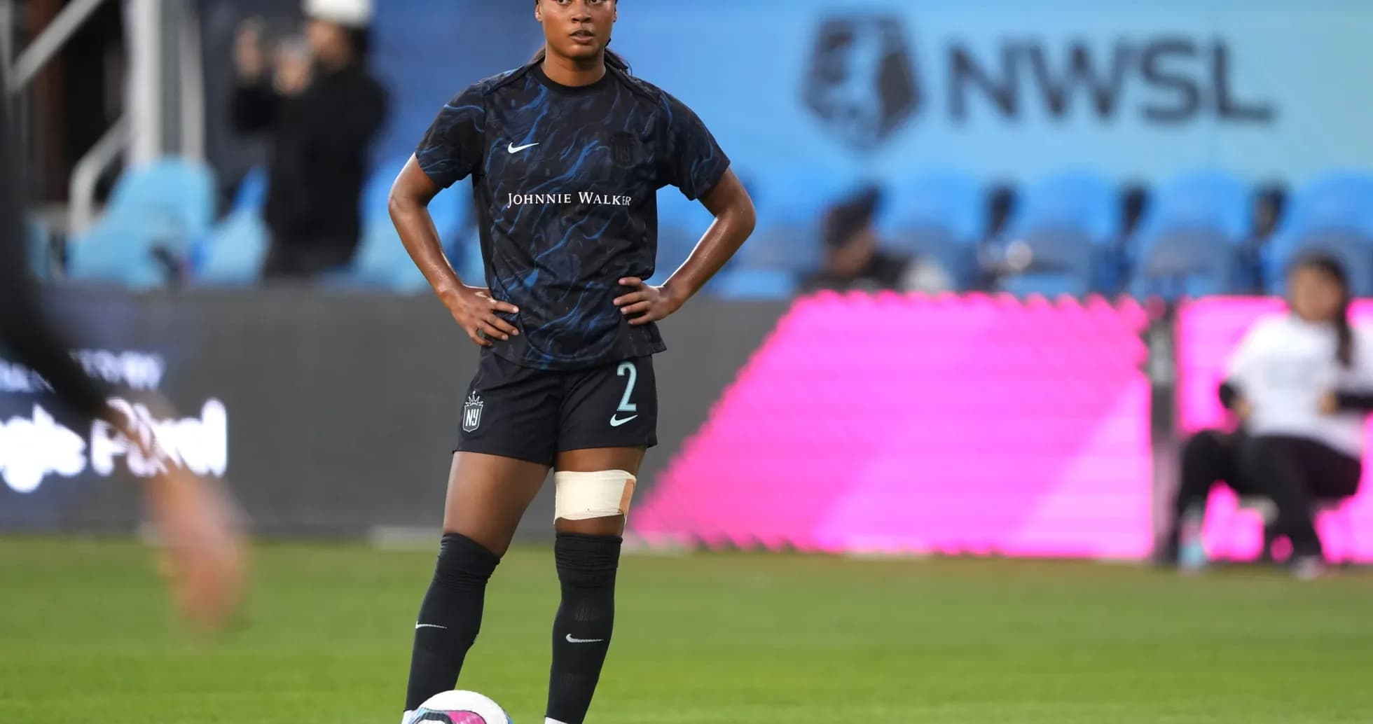 Player preparing for a free kick in NWSL match