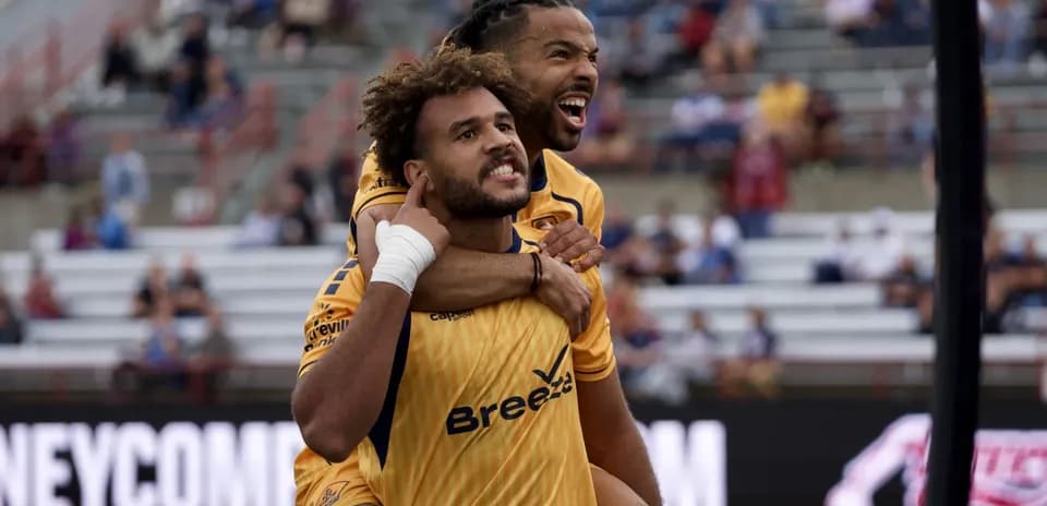 Players celebrating during Indy Eleven match