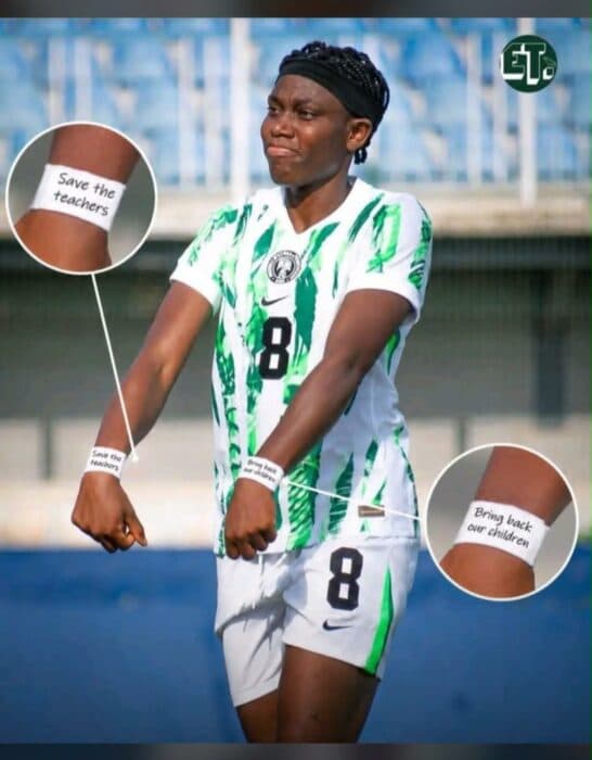 Player displaying wristbands with messages during match
