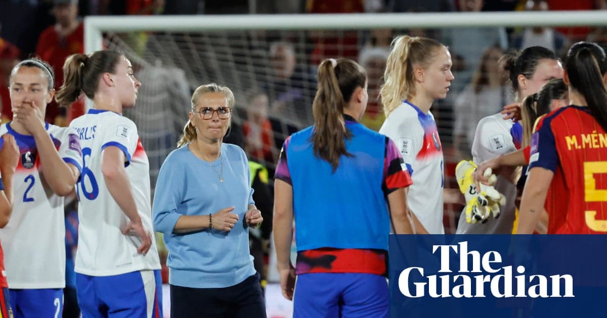 Coaches and players interacting after match conclusion
