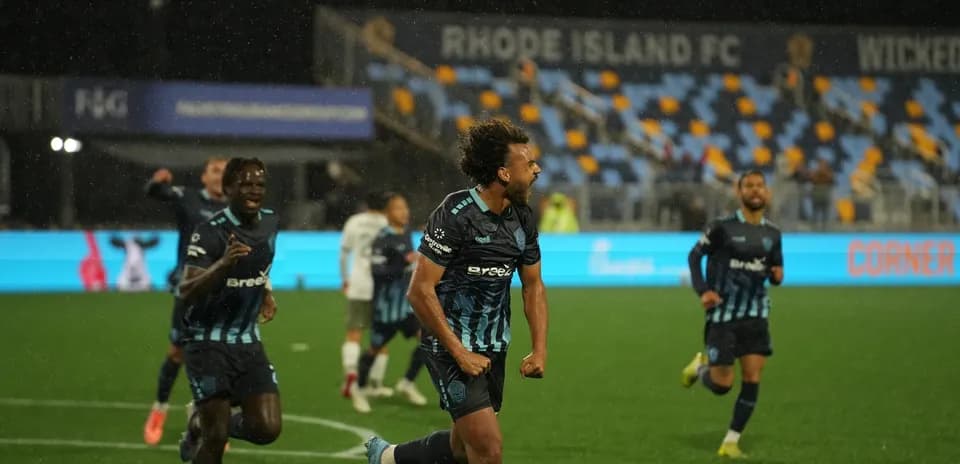 Rhode Island players celebrating a goal
