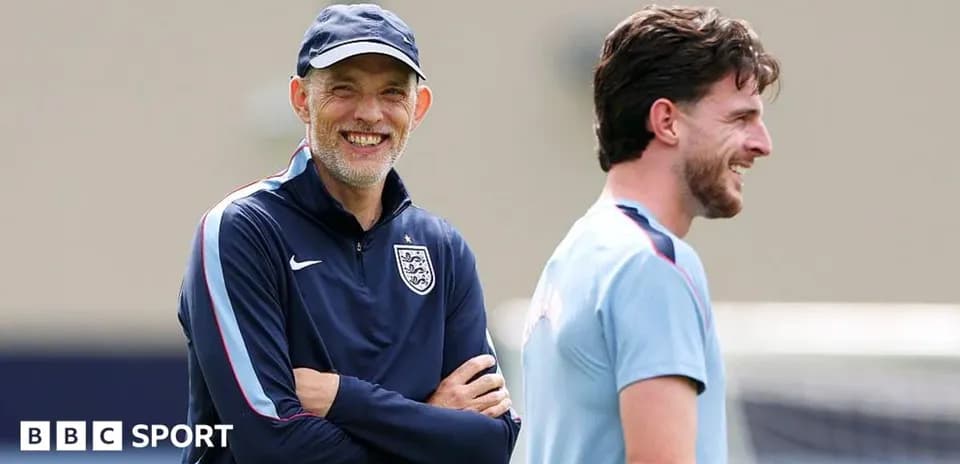 Coach and player smiling during training session
