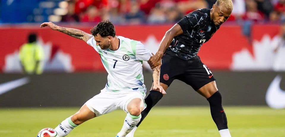 Player attempting to tackle opponent during soccer match