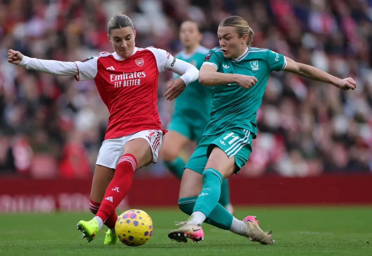 Players contesting for the ball during match