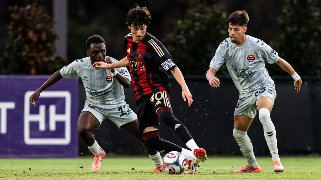 Atlanta United II player dribbling past opponents