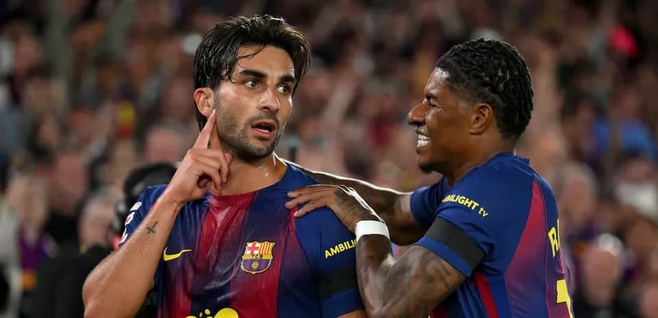 Barcelona players celebrating after scoring a goal