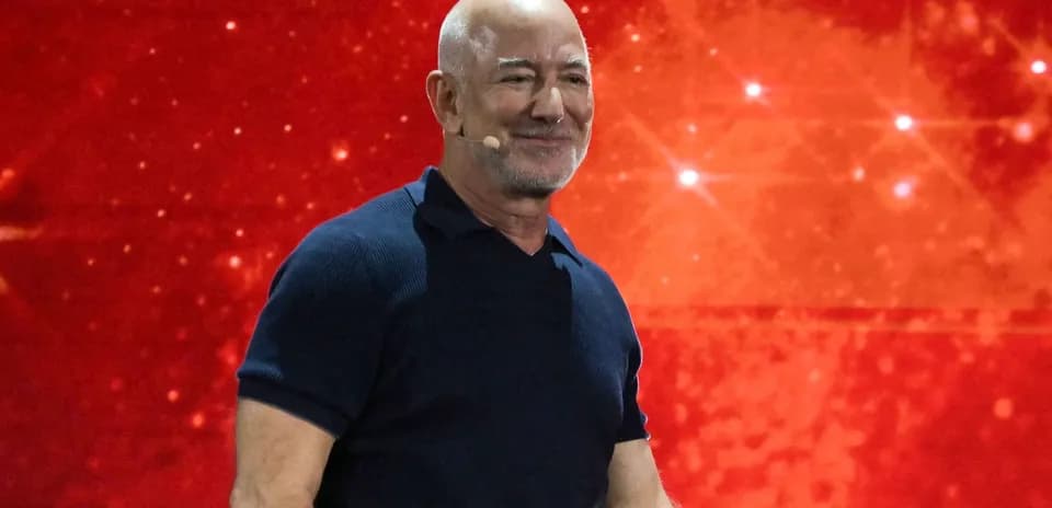 Person speaking at event with red background
