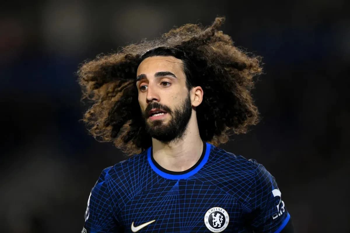 Player with curly hair wearing Chelsea kit
