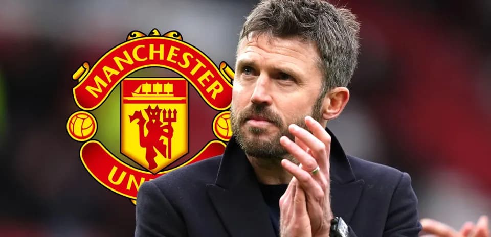 Coach applauding with Manchester United logo in background