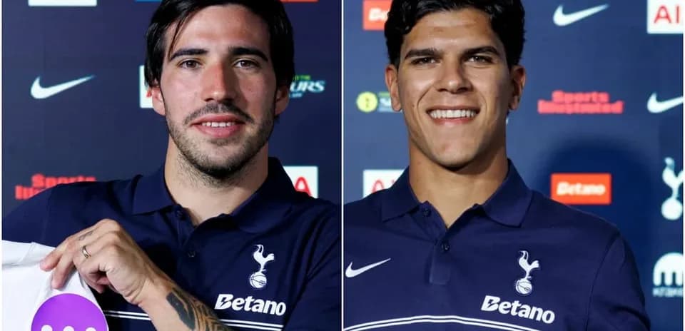 Two football players posing in Tottenham jerseys