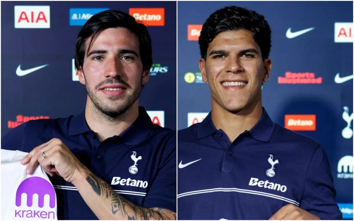 Two football players posing in Tottenham jerseys