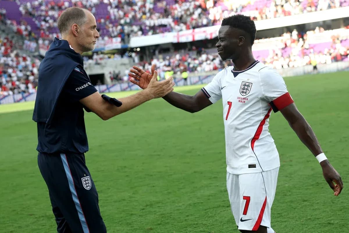 Coach and player shaking hands on the field