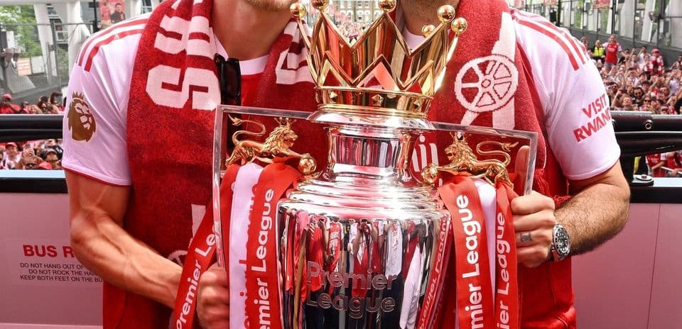 Players celebrating with the Premier League trophy