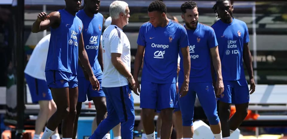 France team training with coach on the pitch