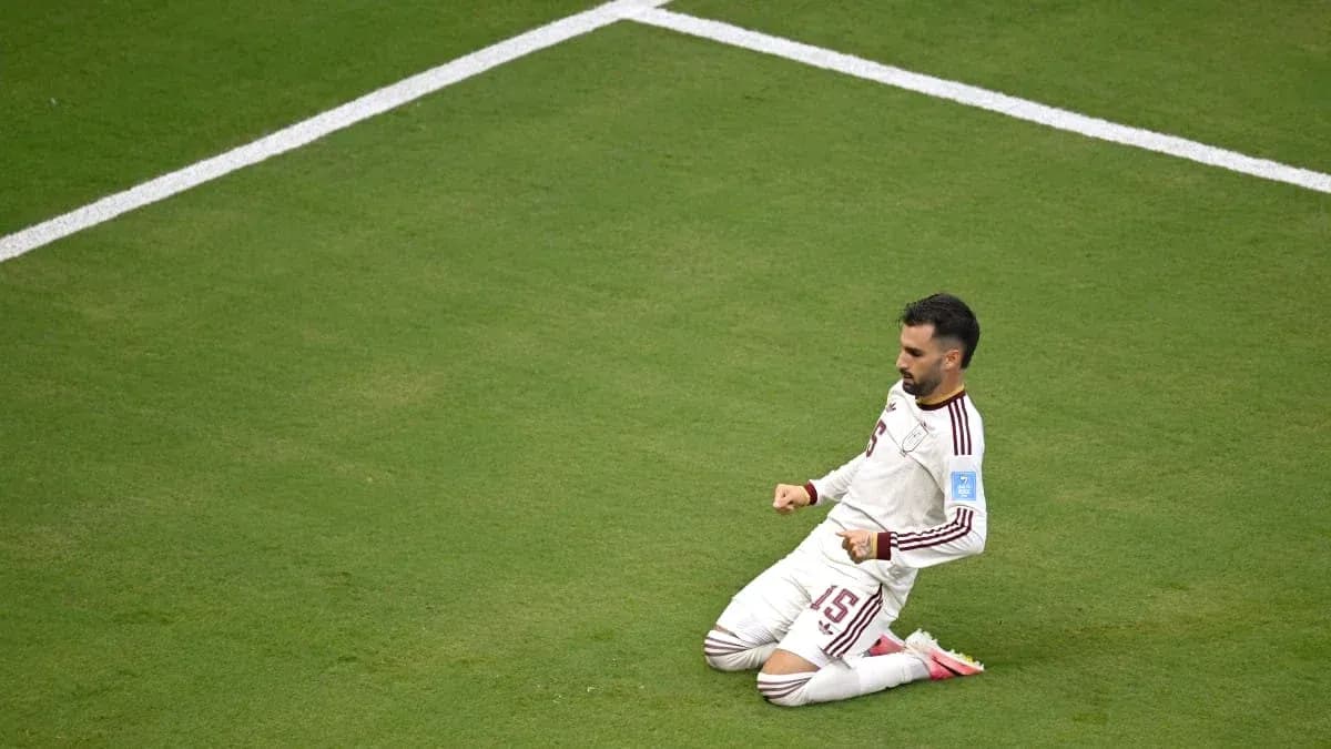 Player celebrating on the field after scoring goal