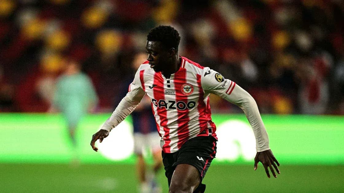Brentford player sprinting on the pitch during match