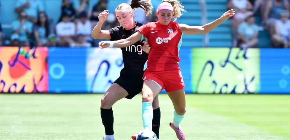 Players competing for the ball during match