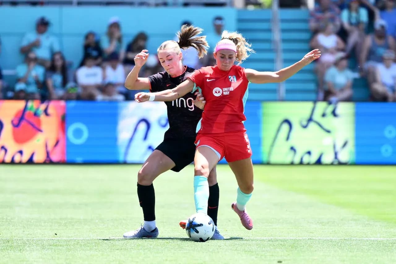 Players competing for the ball during match