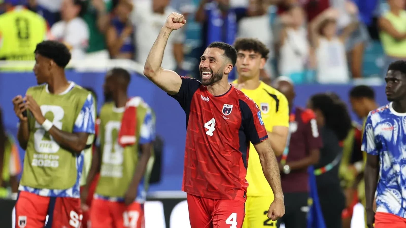 Player celebrating victory after match in stadium