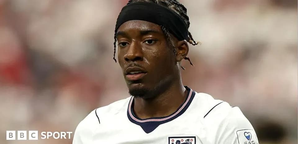 Player in England jersey during match action