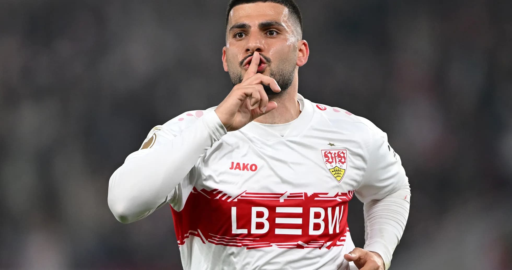 Player celebrating with finger on lips in silence gesture