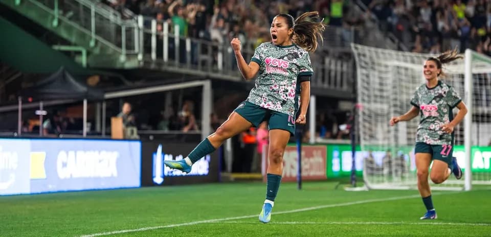 Player celebrating goal during Seattle Reign match
