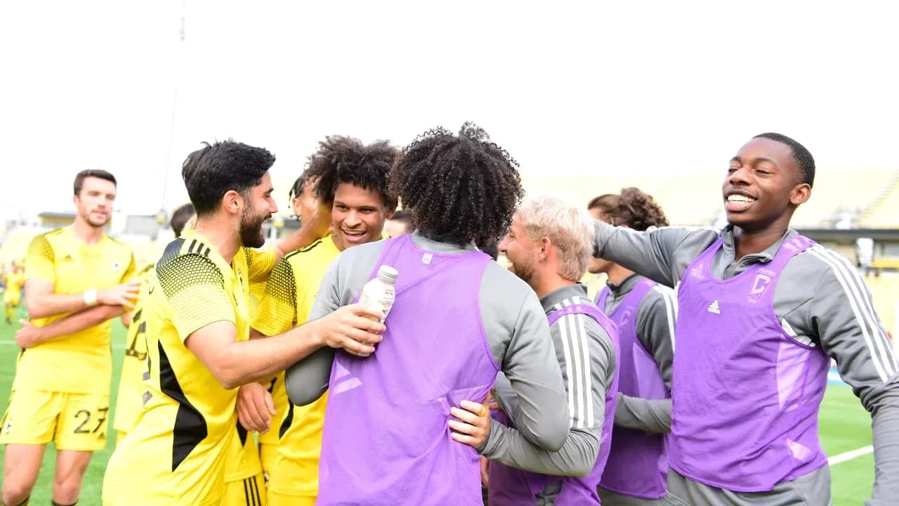 Players celebrating after a match victory