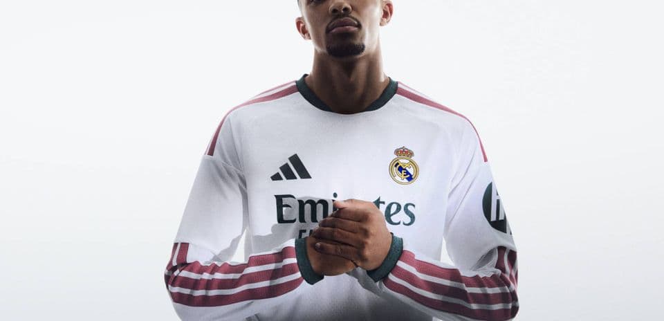 Player in Real Madrid jersey with hands clasped