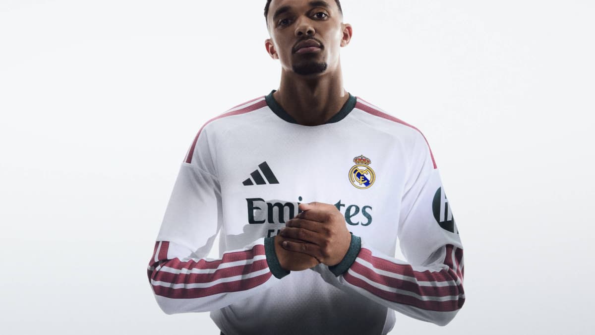 Player in Real Madrid jersey with hands clasped