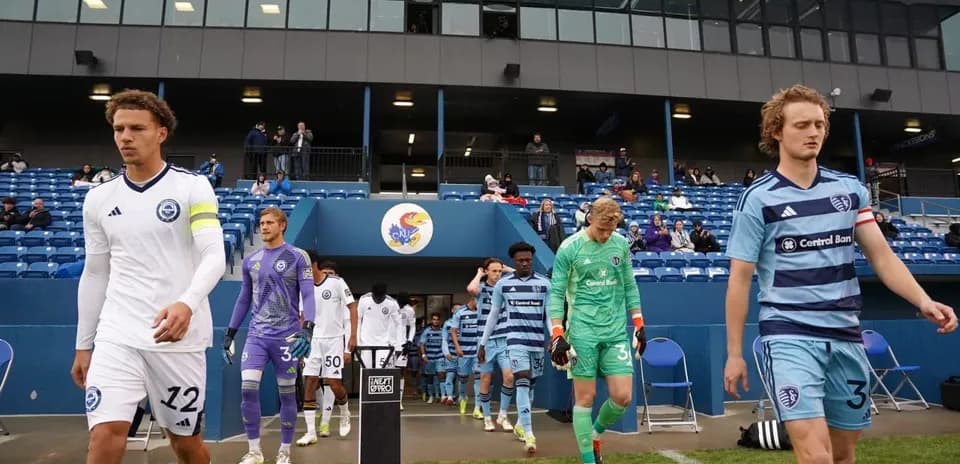 Players entering the field for the match