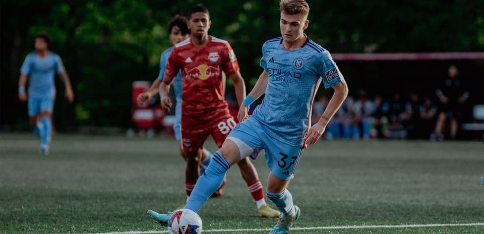 Player from NYC II taking a shot on goal