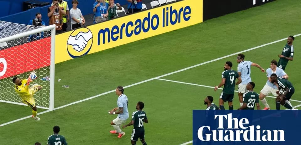Goalkeeper saving a shot during a soccer match