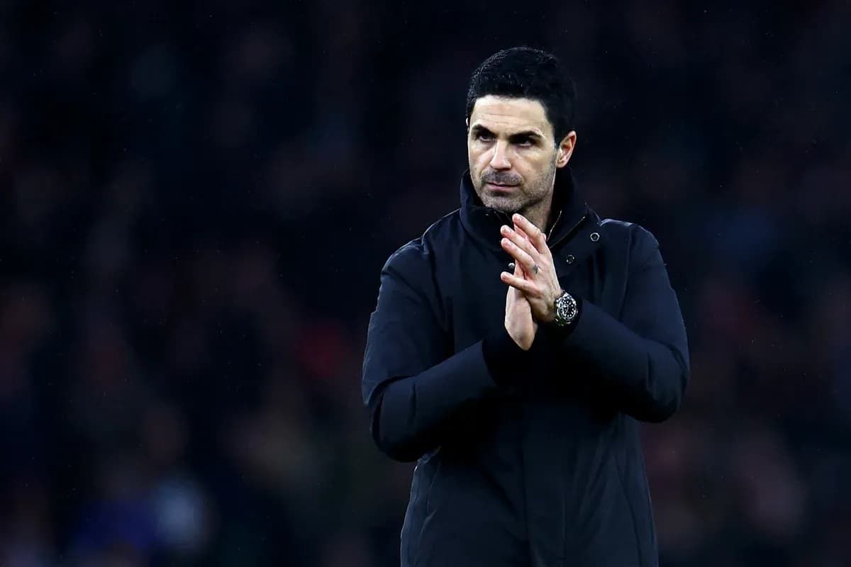 Manager clapping during a match on the sidelines