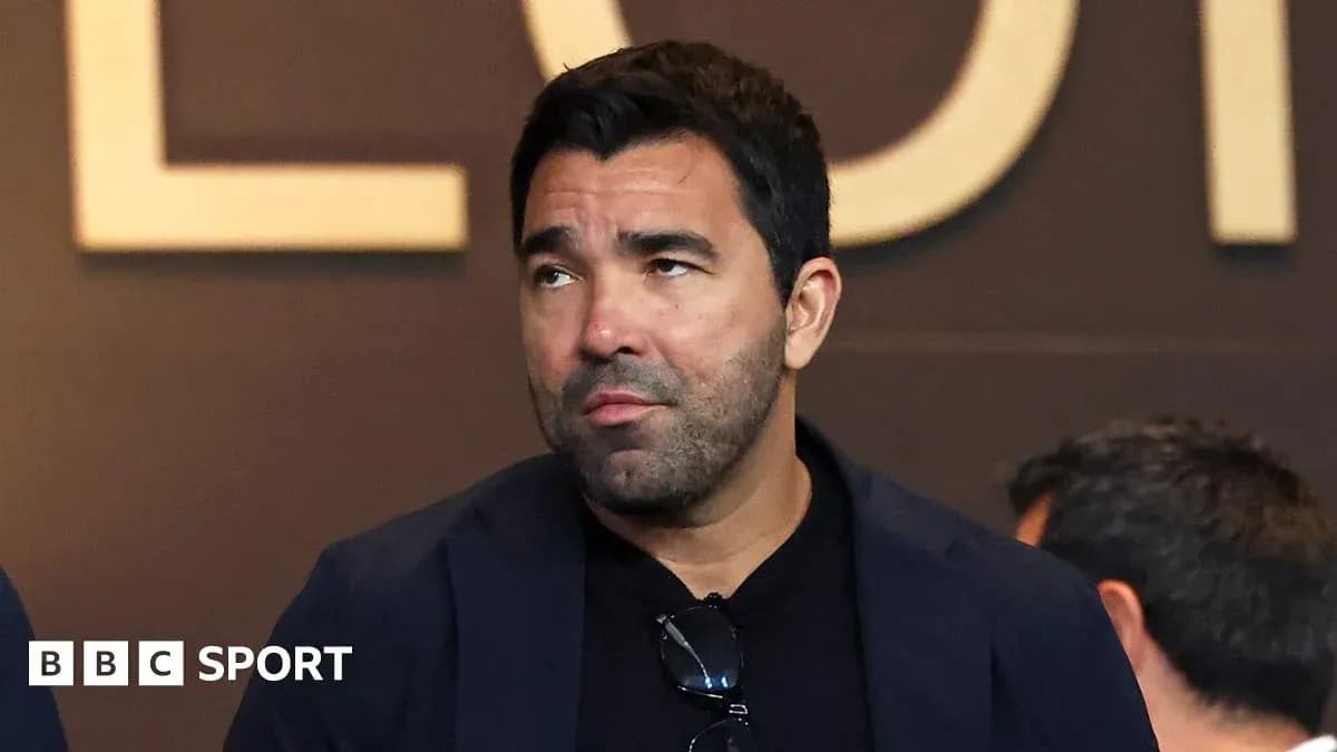 Man in a blazer at a sports event