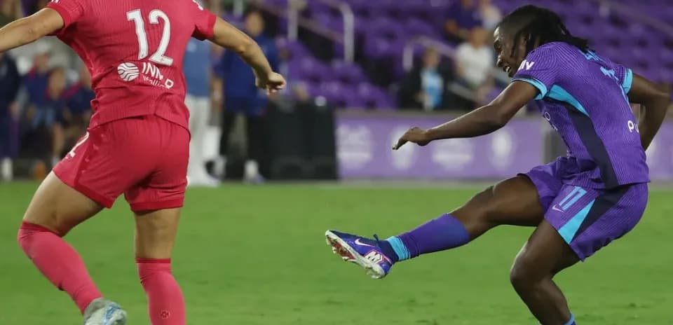 Player kicking the ball during Orlando Pride match