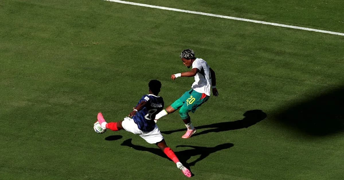 Player evading a tackle during a soccer match