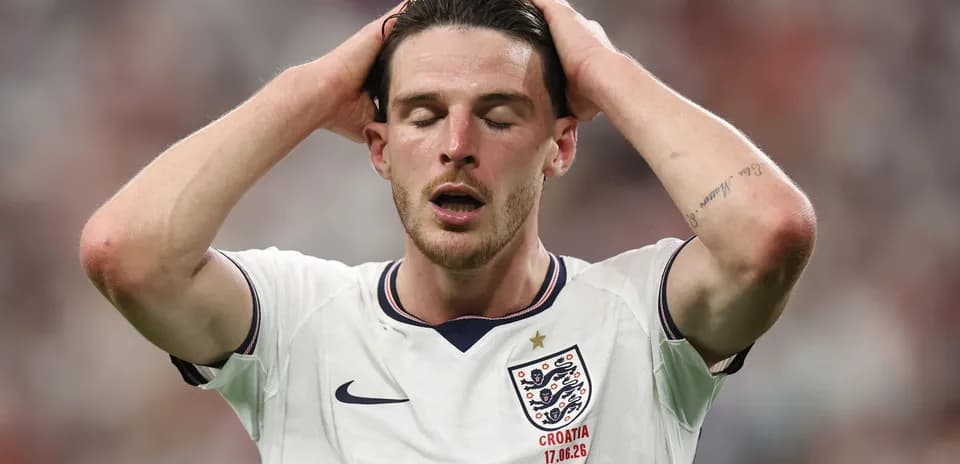Player in England jersey with hands on head
